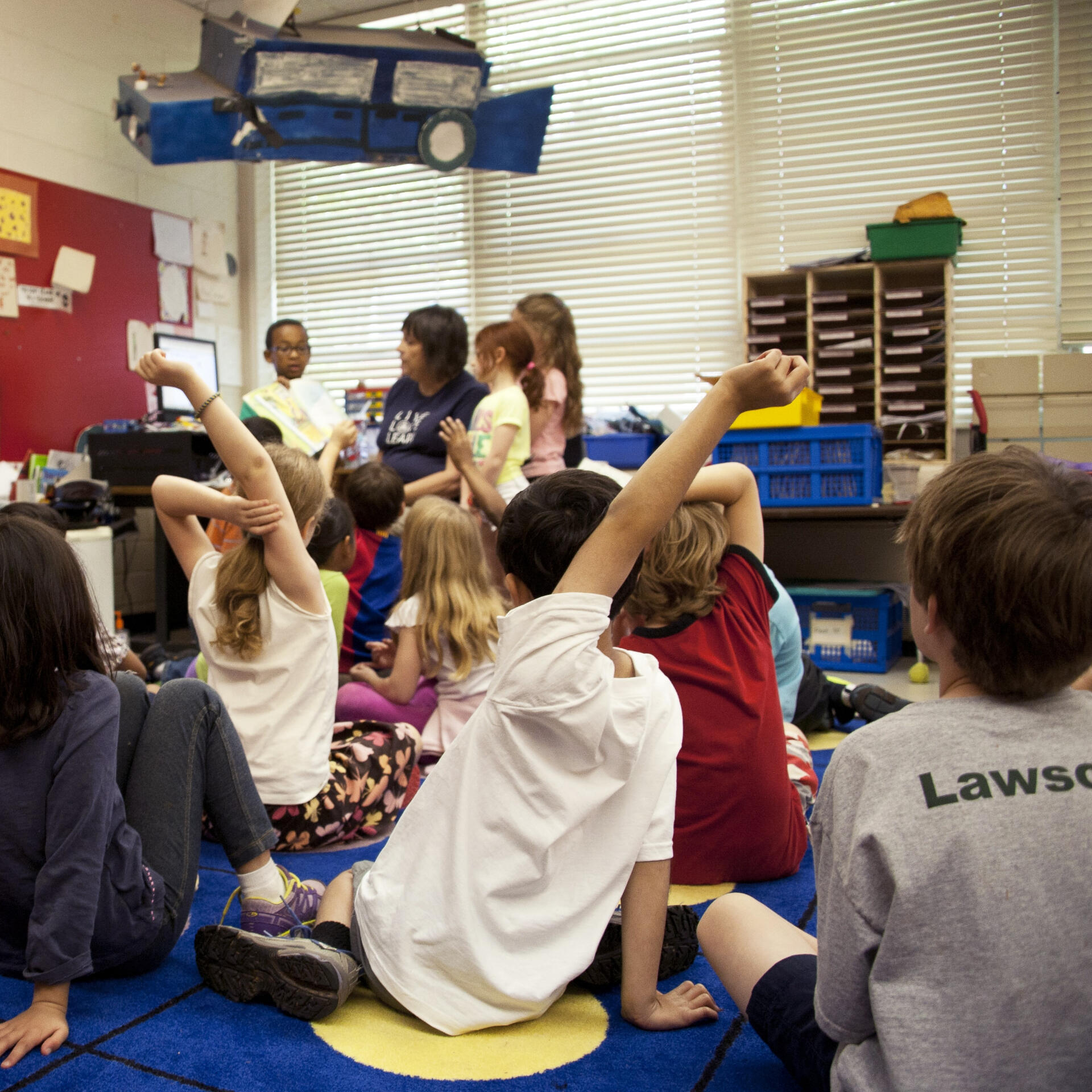elementary school children in classroom with teacher